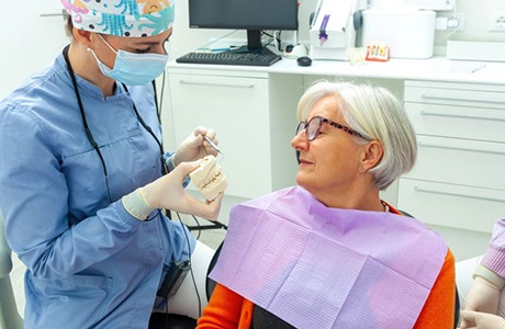 Dental team member and patient talking during consultation