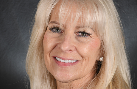Woman with long blonde hair smiling