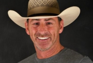 Man in cowboy hat smiling