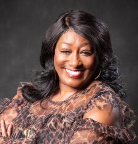 Smiling woman in leopard print blouse