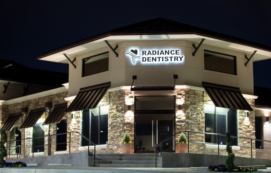 Exterior of Radiance Dentistry Dental Implant Center at night
