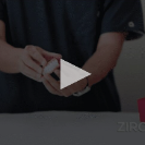 Dentist holding a XircOn implant denture model