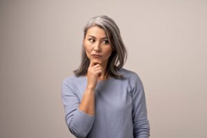 Mature woman wearing curious expression 