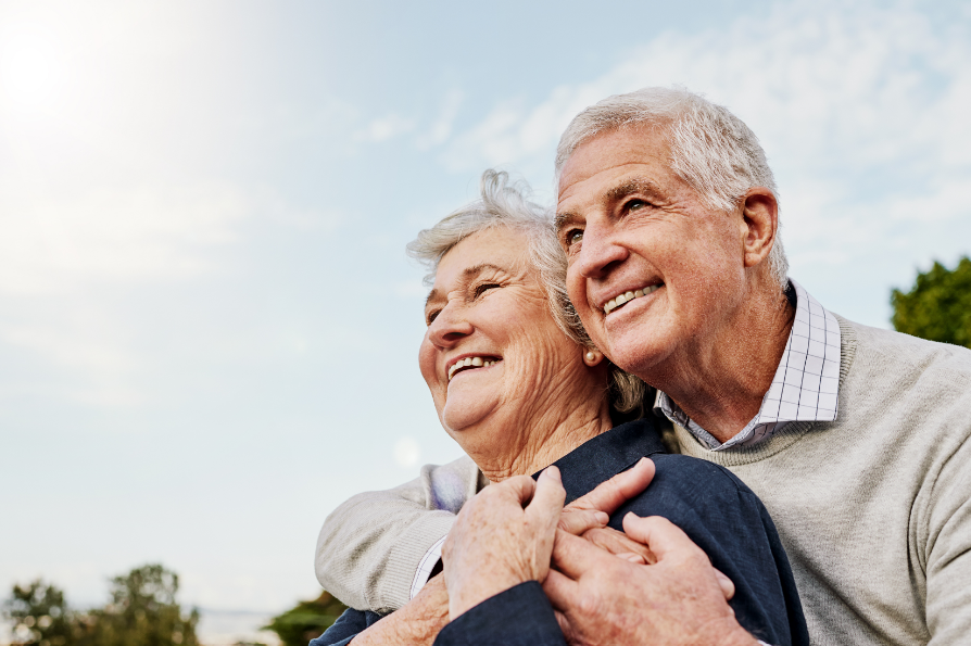 Elderly couple with bright white smiles