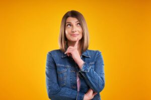 Woman wearing curious, thoughtful expression