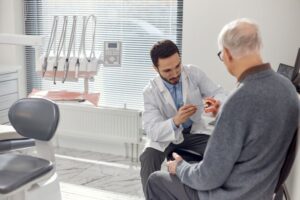 Dentist and patient talking during consultation 